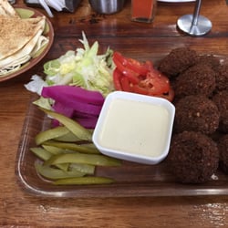 A1 Lebanese Bakery - Falafel Platter with pita bread, falafel balls, pickled cucumbers, pickled turnips, lettuce, tomato and tahini dipping sauce.
