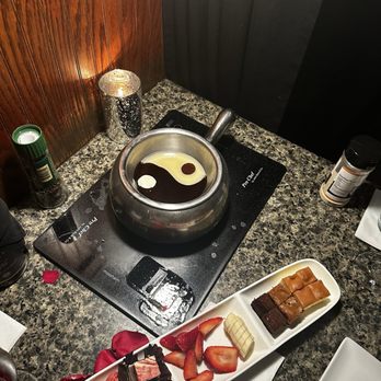 The Melting Pot - Phoenix - Ying and yang dark chocolate and white chocolate fondue! - Fondue Near Me - Phoenix, Arizona The Melting Pot - Phoenix - Ying and yang dark chocolate and white chocolate fondue! - Fondue Near Me - Phoenix, Arizona