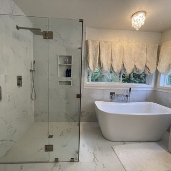 Unique Northwest Building - Master bath and curbless, frameless shower with chandelier and floor and wall tiles. Heated flooring. - General Contractors Near Me Unique Northwest Building - Master bath and curbless, frameless shower with chandelier and floor and wall tiles. Heated flooring. - General Contractors Near Me