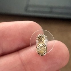 Boutiki - Pineapples that are filled with sand from local beaches. Real silver & petite to fit my ears.