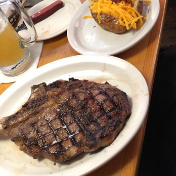 Texas Roadhouse - Nice size ribeye. Don't let it fool ya. It was blue in the inside. The summer shandy was good though :) - American Near Me - Kenosha, Wisconsin