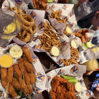 Zipps Sports Grill - Chicken Skewers, Golden Wings, Basket of onion rings, Basket of fries. - Sports Bars Near Me - Phoenix, Arizona