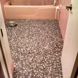 Before. The floor was pink tile as well, but they replaced that with the ceramic tile you see in this picture.