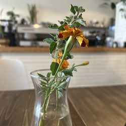 Margin Coffee - Lovely fresh flowers that are on many of the tables here.
