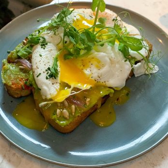 Commons Club - avocado toast with poached eggs - Wine Bars Near Me - New Orleans, Louisiana Commons Club - avocado toast with poached eggs - Wine Bars Near Me - New Orleans, Louisiana