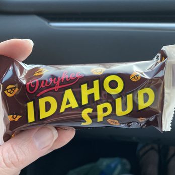 Village Market - a hand holding a chocolate bar - Grocery Near Me - Ketchum, Idaho Village Market - a hand holding a chocolate bar - Grocery Near Me - Ketchum, Idaho