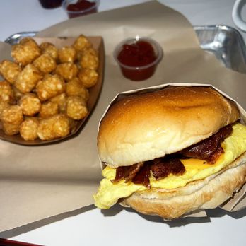 Papa Z's - Breakfast Sandwich Bacon and Egg with tater tots. - Breakfast & Brunch Near Me - Fountain Valley, California Papa Z's - Breakfast Sandwich Bacon and Egg with tater tots. - Breakfast & Brunch Near Me - Fountain Valley, California