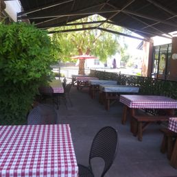 Outdoor dining area on side of restaurant Outdoor dining area on side of restaurant