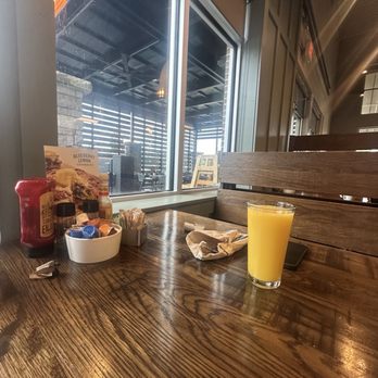 First Watch - Table items + orange juice - Breakfast & Brunch Near Me - Decatur, Georgia