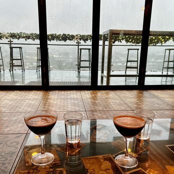 Hot Tin - Rainy view with espresso martini - Cocktail Bars Near Me - New Orleans, Louisiana