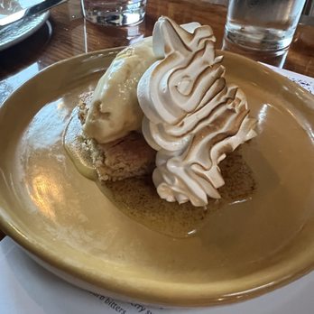 MariPili Tapas Bar - Tarta De Santiago - almond cake, toasted egg yolk, turron ice cream, and toasted meringue - Spanish Near Me - Seattle, Washington MariPili Tapas Bar - Tarta De Santiago - almond cake, toasted egg yolk, turron ice cream, and toasted meringue - Spanish Near Me - Seattle, Washington