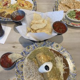 3 plates of food and some chips