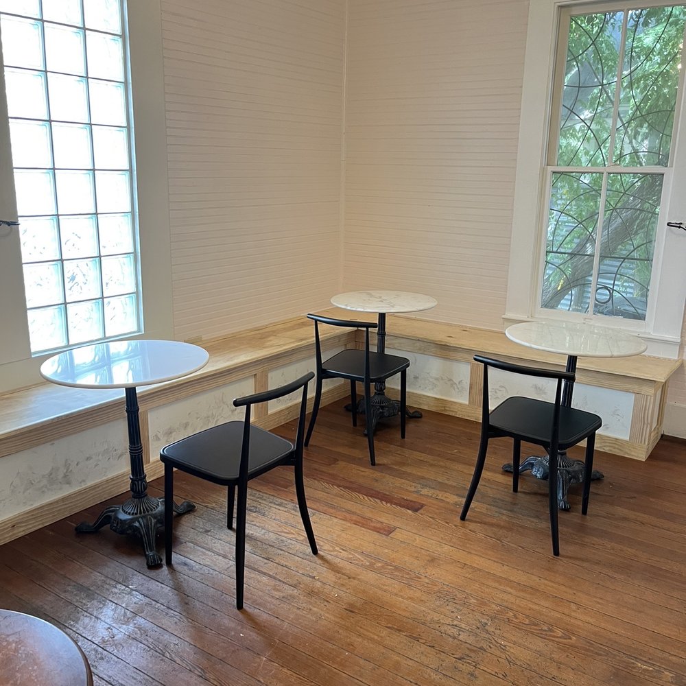 La Patisserie - a table and chairs in a room - Desserts Near Me - Austin, Texas