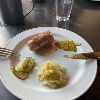 Otto's - My dinner of sauerkraut, spicy mustard, sweet pickles, and a very well flavored wurst sausage - German Near Me - Fredericksburg, Texas