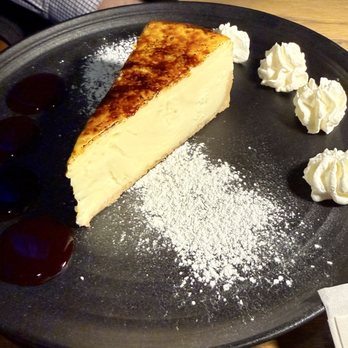 Bourbons Craft Kitchen And Bar - Cheesecake with raspberry & whipped cream. Had a crème brûlée top. - Burgers Near Me - Cincinnati, Ohio Bourbons Craft Kitchen And Bar - Cheesecake with raspberry & whipped cream. Had a crème brûlée top. - Burgers Near Me - Cincinnati, Ohio