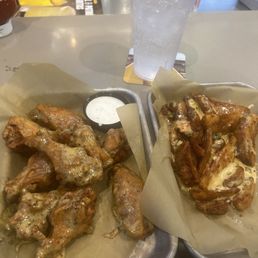 Parmesan Garlic Bone in Wing with Wedges and Queso Sauce. Parmesan Garlic Bone in Wing with Wedges and Queso Sauce.