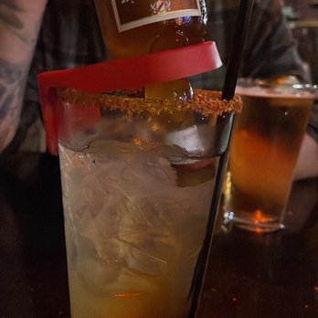 Secret Bar & Grill - a man sitting at a bar - Sports Bars Near Me - Los Angeles, California Secret Bar & Grill - a man sitting at a bar - Sports Bars Near Me - Los Angeles, California