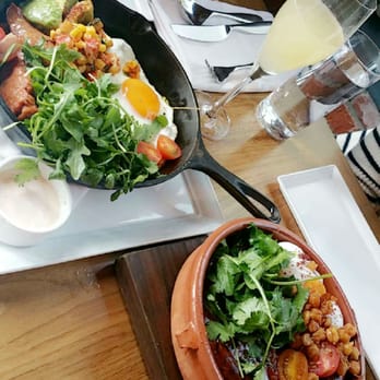Chambar - In the cast iron skillet: Paella. In the clay pot: Tajine. In the flute: Grapefruit juice + bubbles. - Belgian Near Me - Vancouver, British Columbia Chambar - In the cast iron skillet: Paella. In the clay pot: Tajine. In the flute: Grapefruit juice + bubbles. - Belgian Near Me - Vancouver, British Columbia