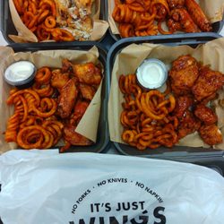 It’s Just Wings - 4 different flavors. Top left: Ranch, right apple BBQ, bottom left: something chipotle right mango habanero boneless