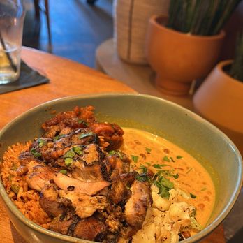 ChopnBlok - Montrose - Golden, similar to jollof rice and chicken. The Jambalaya curry was a great pairing. This meal was light - African Near Me - Houston, Texas