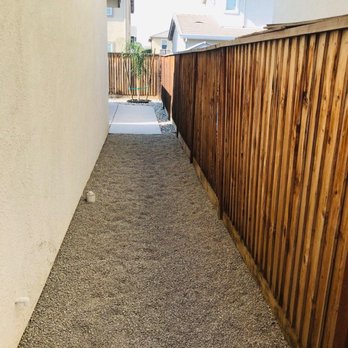 Sunset Landscaping Services - Side yard. Removed weeds, leveled dirt and added weed barrier with pea gravel - Landscaping Near Me
