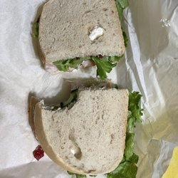 Delicious turkey, cranberry, cream cheese on sourdough.