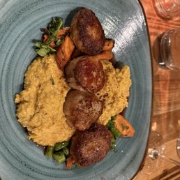 Scallops and crab cakes over risotto