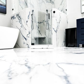 HenCo Construction - a bathroom with a marble floor - General Contractors Near Me HenCo Construction - a bathroom with a marble floor - General Contractors Near Me