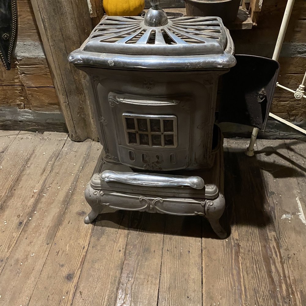 Kirk's Ferry Trading Post - an old stove with a pumpkin on top - Barbeque Near Me - Brownsville, Oregon