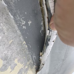 Rubber peaking off the bottom.   Flooding the boat with water.