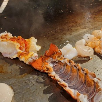 Benihana - Plano - a variety of seafoods being cooked on a grill - Steakhouses Near Me - Plano, Texas