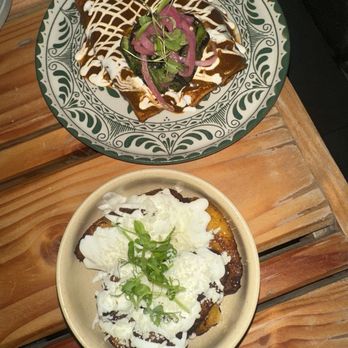 Tabú - Enchiladas on top  Sweet plantains with crema on top. - New Mexican Cuisine Near Me - Brooklyn, New York