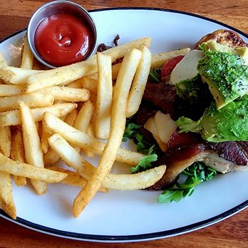 54th Street Restaurant & Drafthouse - My Chicken Avocado Grille, sans bun. Generous chunks of avocado on top, wonderful bacon, and jack cheese. Crisp seasoned fries. - American Near Me - Pflugerville, Texas