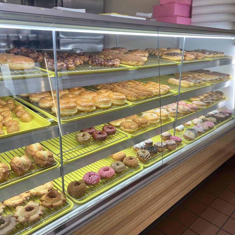 Top Donut - a variety of donuts in a display case - Donuts Near Me - Granada Hills, California