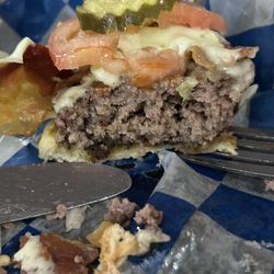 Jerry's Inn - Hamburger that was supposed to be medium rare. Cook said no way.  Never came to look either.