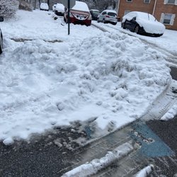 Lerner University Square - Snow plowed into the handicap spot (daytime)