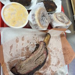 Dino rib, brisket sandwich, jalapeño poppers with Mac and cheese. Dino rib, brisket sandwich, jalapeño poppers with Mac and cheese.
