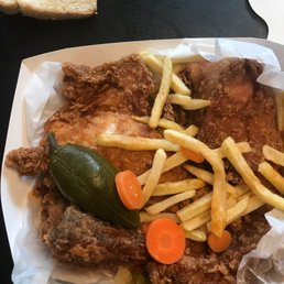 a plate of fried chicken and french fries a plate of fried chicken and french fries