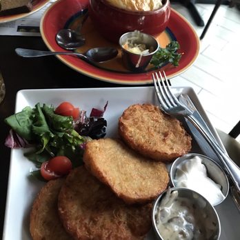 Tryzub Ukrainian Kitchen - Traditional Potato Pancakes, Goulash in a Pot in the background - Ukrainian Near Me - Chicago, Illinois