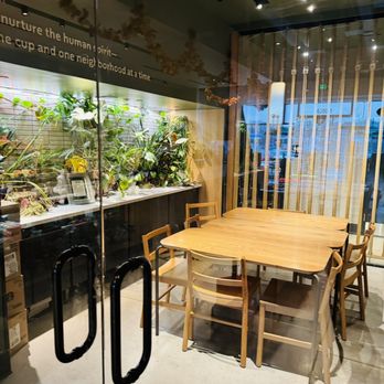 Starbucks - a table and chairs in a coffee shop - Coffee & Tea Near Me - Hyattsville, Maryland