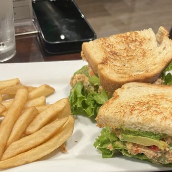 Sidetrack Bar + Grill - Crab sandwich and fries , the fries are a nice portion I just happened to start eating them before taking the photo lol - American Near Me - Pleasanton, California