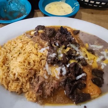 Marcos Mexican Restaurant - Enchilada covered with beef fajita meat and chili. - Mexican Near Me - Frankston, Texas Marcos Mexican Restaurant - Enchilada covered with beef fajita meat and chili. - Mexican Near Me - Frankston, Texas