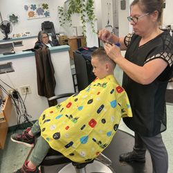 Shear Madness Hair Styling - This is my son and his new stylist Margarita. She rocks!