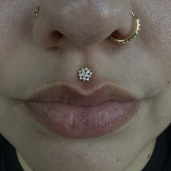 Deep Roots Tattoo & Body Piercing - Medusa piercing done by Kat and styled by Ivy with jewelry from Buddha Jewelry.