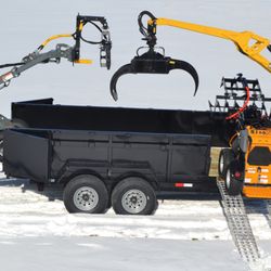 Brownwood Sales - Giant Loaders driving on to a Treeler dumping grapple trailer