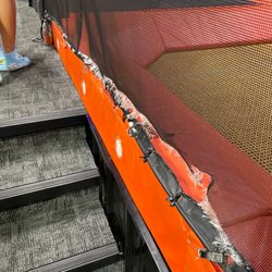 Urban Air Trampoline and Adventure Park - Ripped safety net.