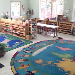 Children's Village Montessori - In our classroom, Montessori learning materials are arranged invitingly on low, open shelves.