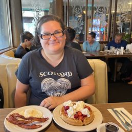 Belgian waffle with whip cream, strawberry eggs, and bacon Belgian waffle with whip cream, strawberry eggs, and bacon