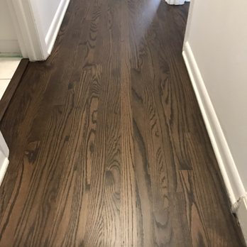 Elite Flooring - a hardwood floor in a hallway - Flooring Near Me