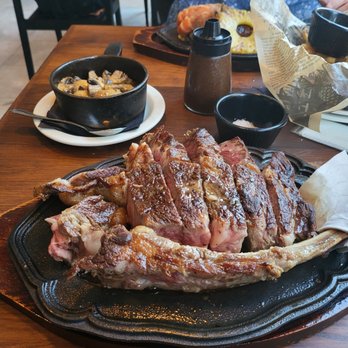 Aloha Steak House - Tamahawk steak with side of mushrooms - Steakhouses Near Me - Honolulu, Hawaii